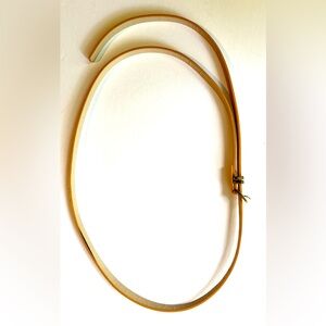 NWOT. Slim, extra long, yellow belt.